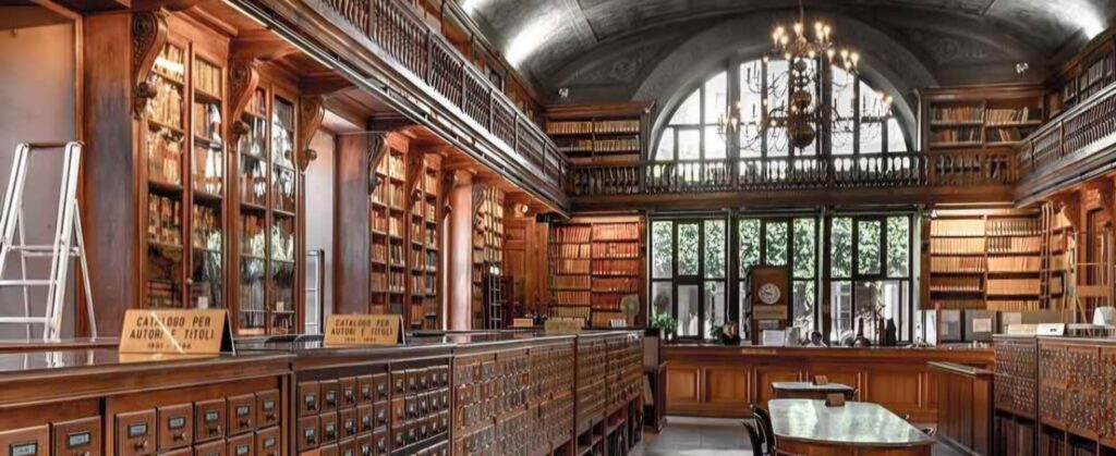 Historic reading room in Milan showing one of the best answers to where to study in Milan, with wooden shelves, high ceilings, and quiet study tables.