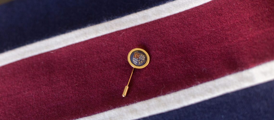 Winter school uniform scarf in soft, warm fabric shown in close-up detail.